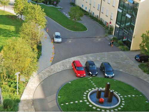 Roundabout with lawn and water feature